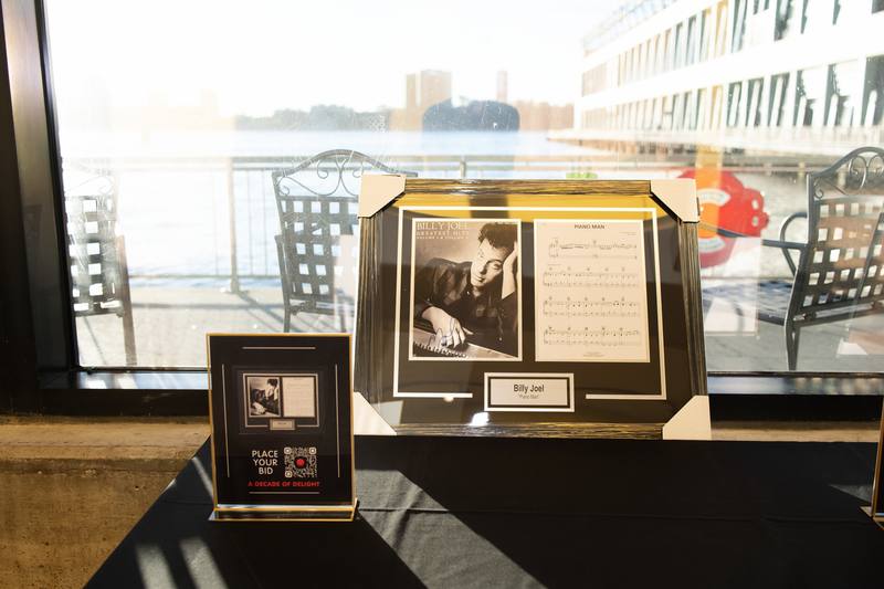A silent auction lot on display before the doors opened at A Decade of Delight — photo 2 of 10.
